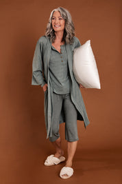 Model Luisa wearing size S of the Bamboo Robe in colour Moss (Green), from the front, showing the whole outfit