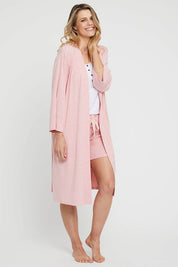 A model wearing the Bamboo Robe in colour Rose (Pink), from the front, showing the whole outfit