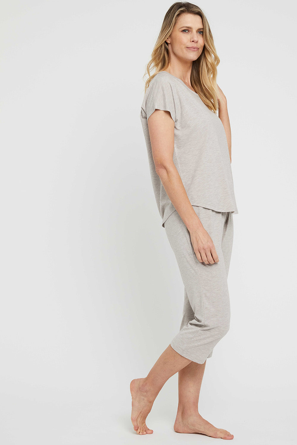 A model wearing the Lounge Bamboo Tee in colour Oatmeal, from the front, showing the whole outfit
