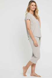A model wearing the Lounge Bamboo Tee in colour Oatmeal, from the front, showing the whole outfit