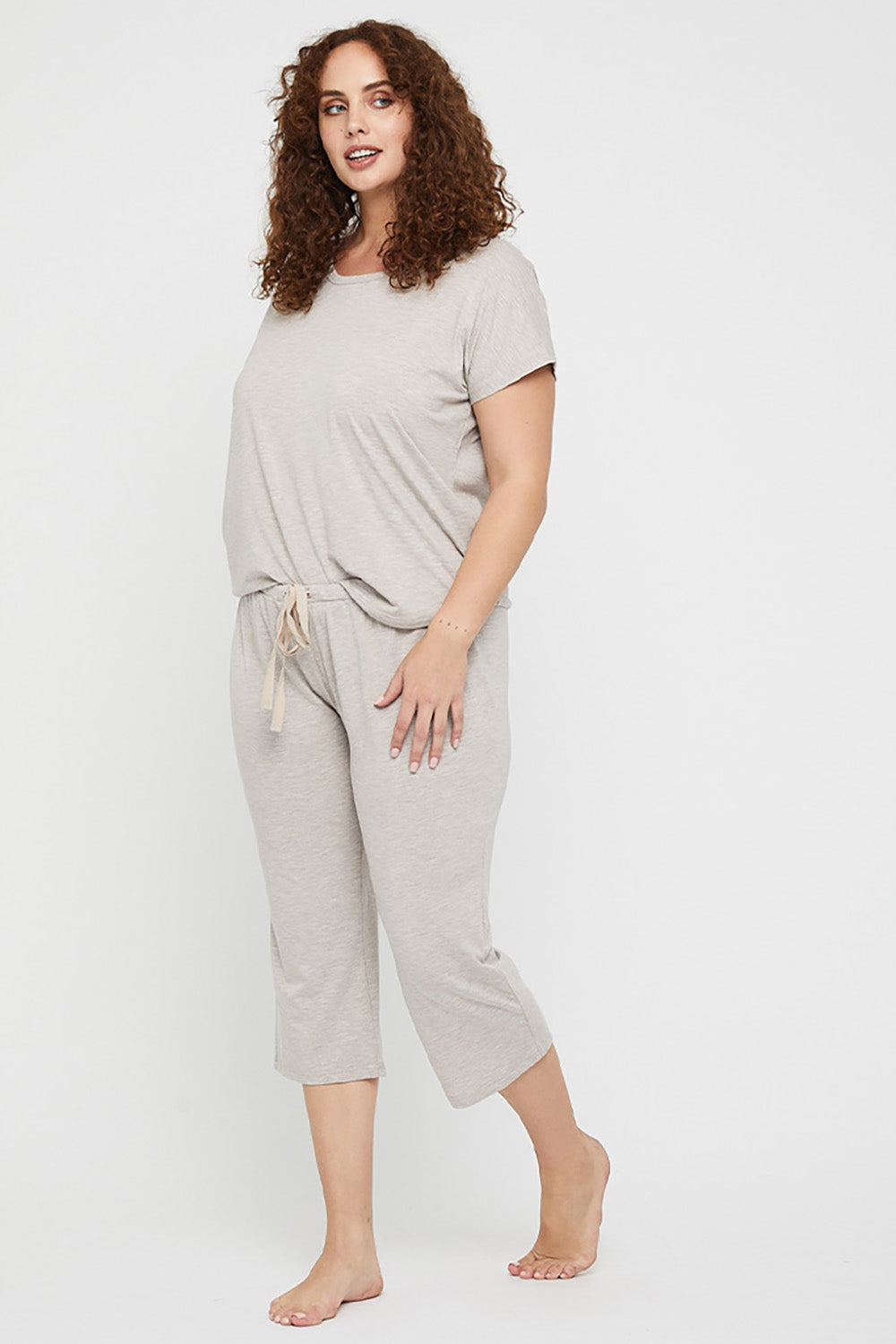A model wearing the Lounge Bamboo Tee in colour Oatmeal, from the front, showing the whole outfit