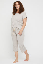 A model wearing the Lounge Bamboo Tee in colour Oatmeal, from the front, showing the whole outfit