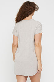 A model wearing the Bamboo Nightie in colour Oatmeal, from the back