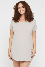 A model wearing the Bamboo Nightie in colour Oatmeal, from the front, cropped image