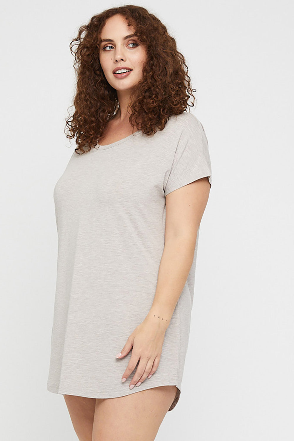 A model wearing the Bamboo Nightie in colour Oatmeal, from the front, cropped image