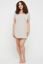 A model wearing the Bamboo Nightie in colour Oatmeal, from the front, showing the whole outfit
