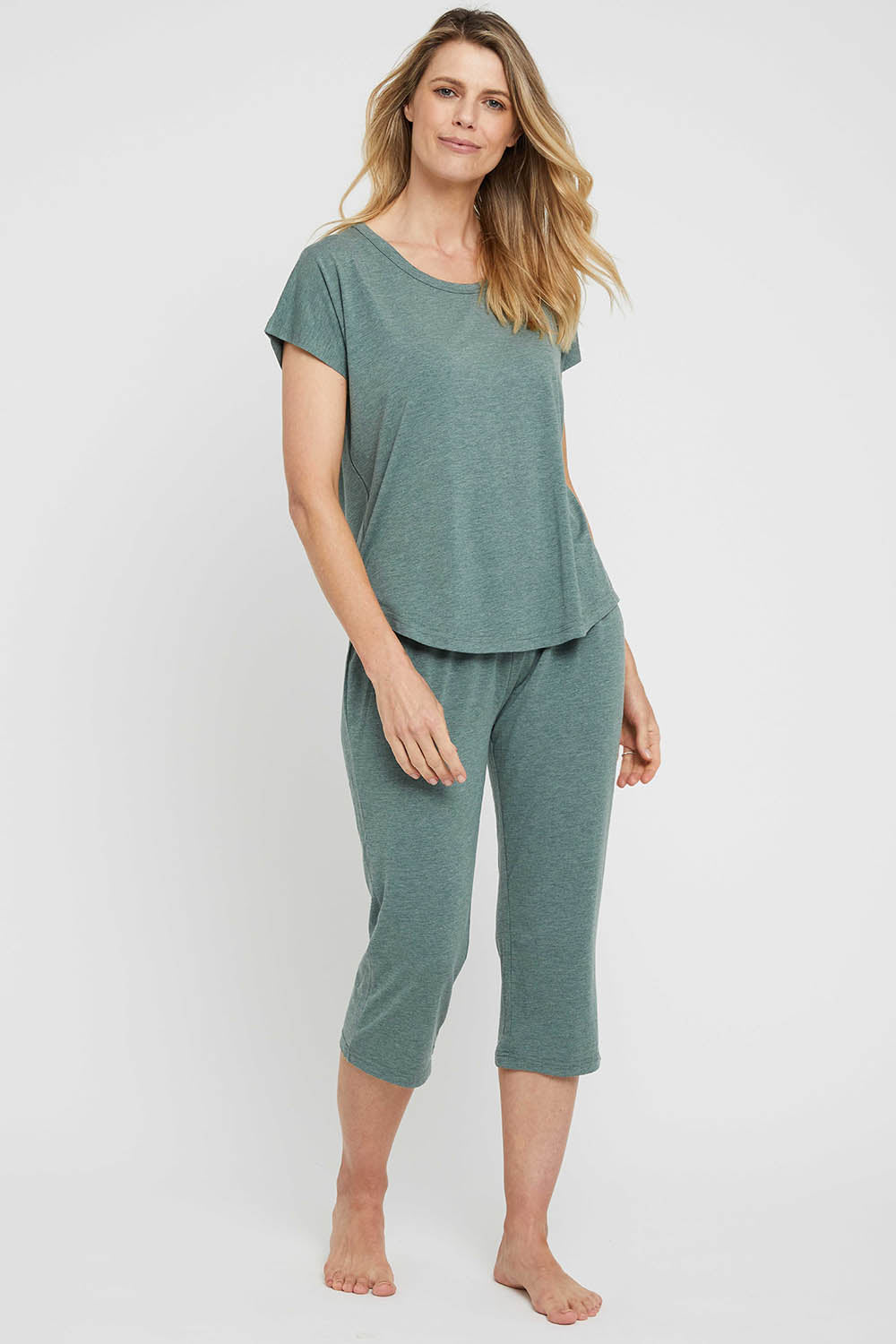 A model wearing the 3/4 Bamboo PJ Pant in colour Moss (Green), from the front, showing the whole outfit