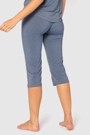 A model wearing the 3/4 Bamboo PJ Pant in colour Twilight (Blue), from the back