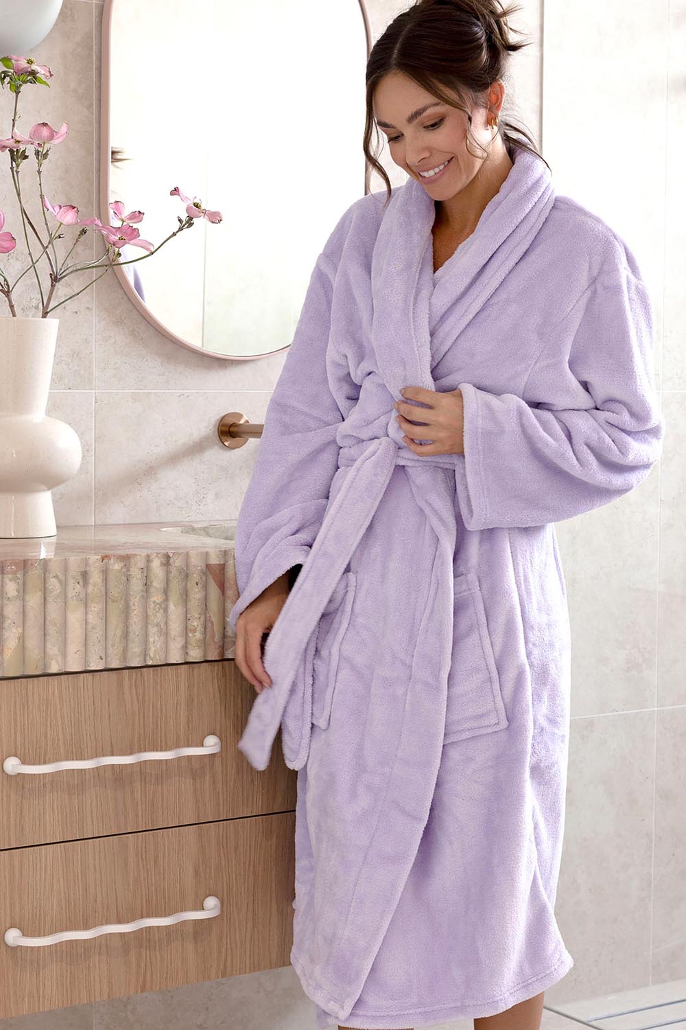Model Genericm wearing size sample of the Microplush Bath Robe - Lilac in colour Lilac, in a cropped view