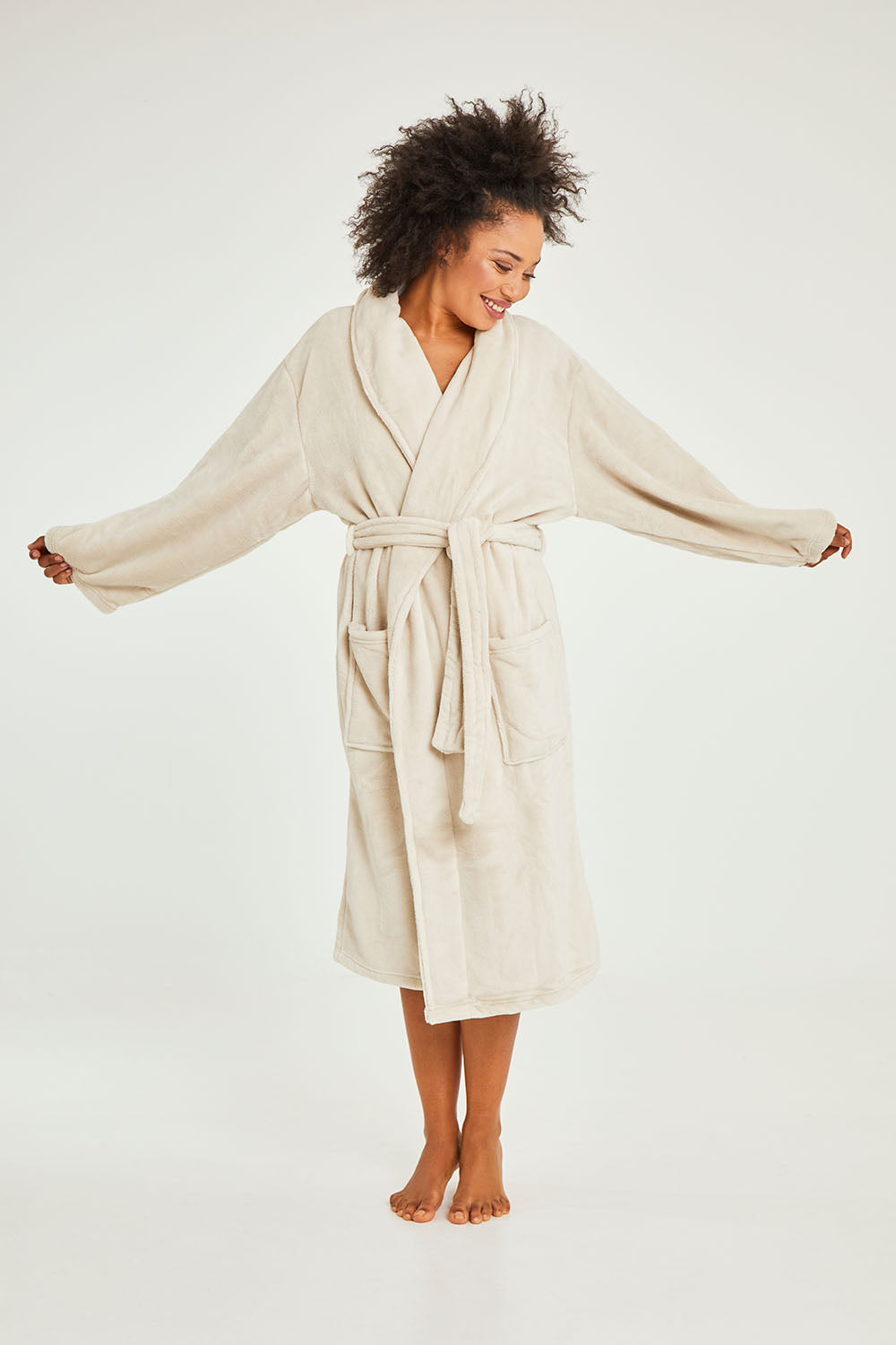 Model Olivia wearing the Microplush Bath Robe in colour Stone, from the front, showing the whole outfit