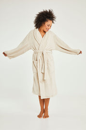 Model Olivia wearing the Microplush Bath Robe in colour Stone, from the front, showing the whole outfit