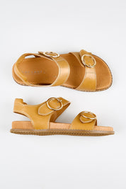 Model Genericm wearing size sample of the Molly Leather Velcro Slide - Lighttan in colour Lighttan, from an angle
