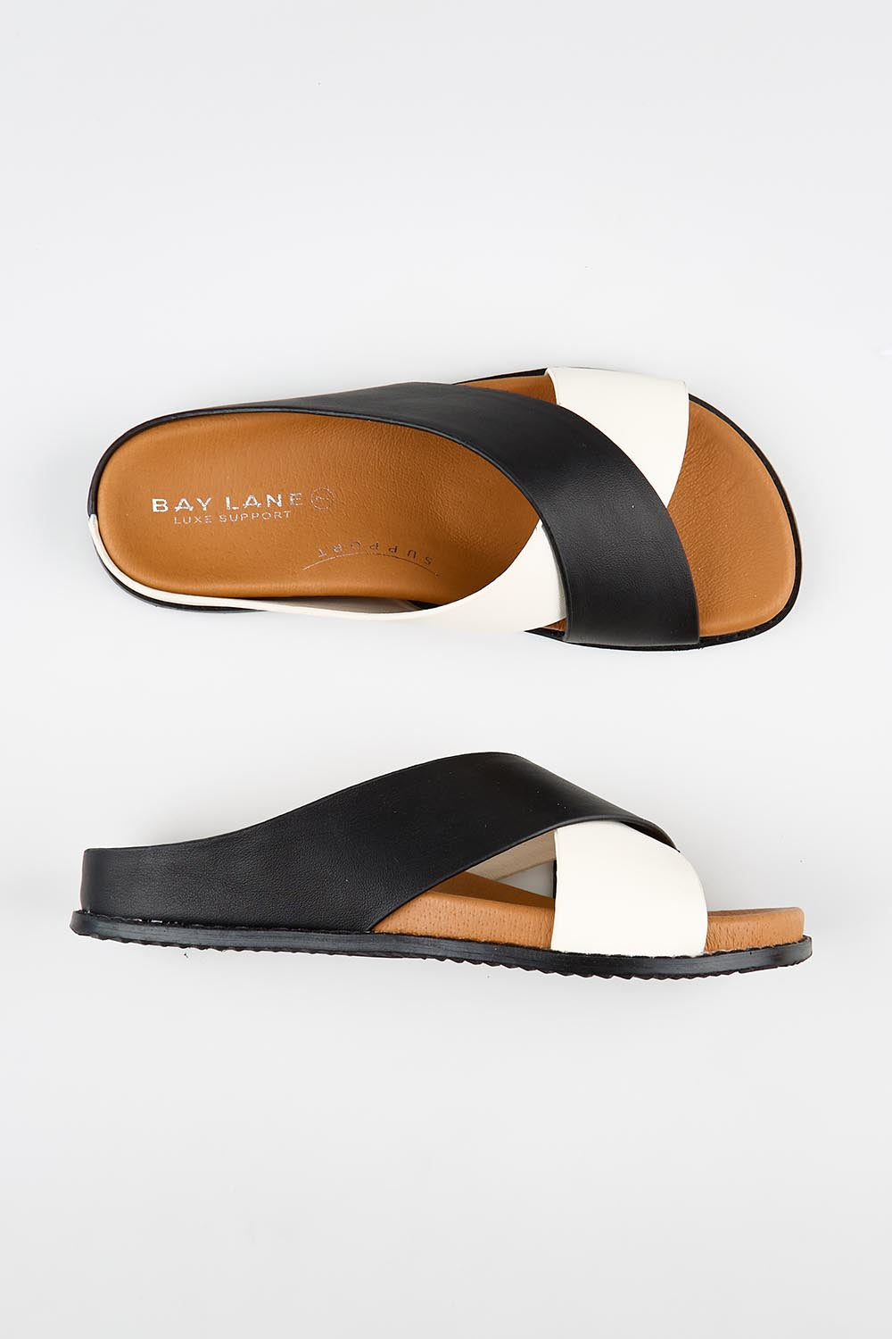 Model Genericm wearing size sample of the Mystic Leather Slide - Blackice in colour Blackice, from an angle