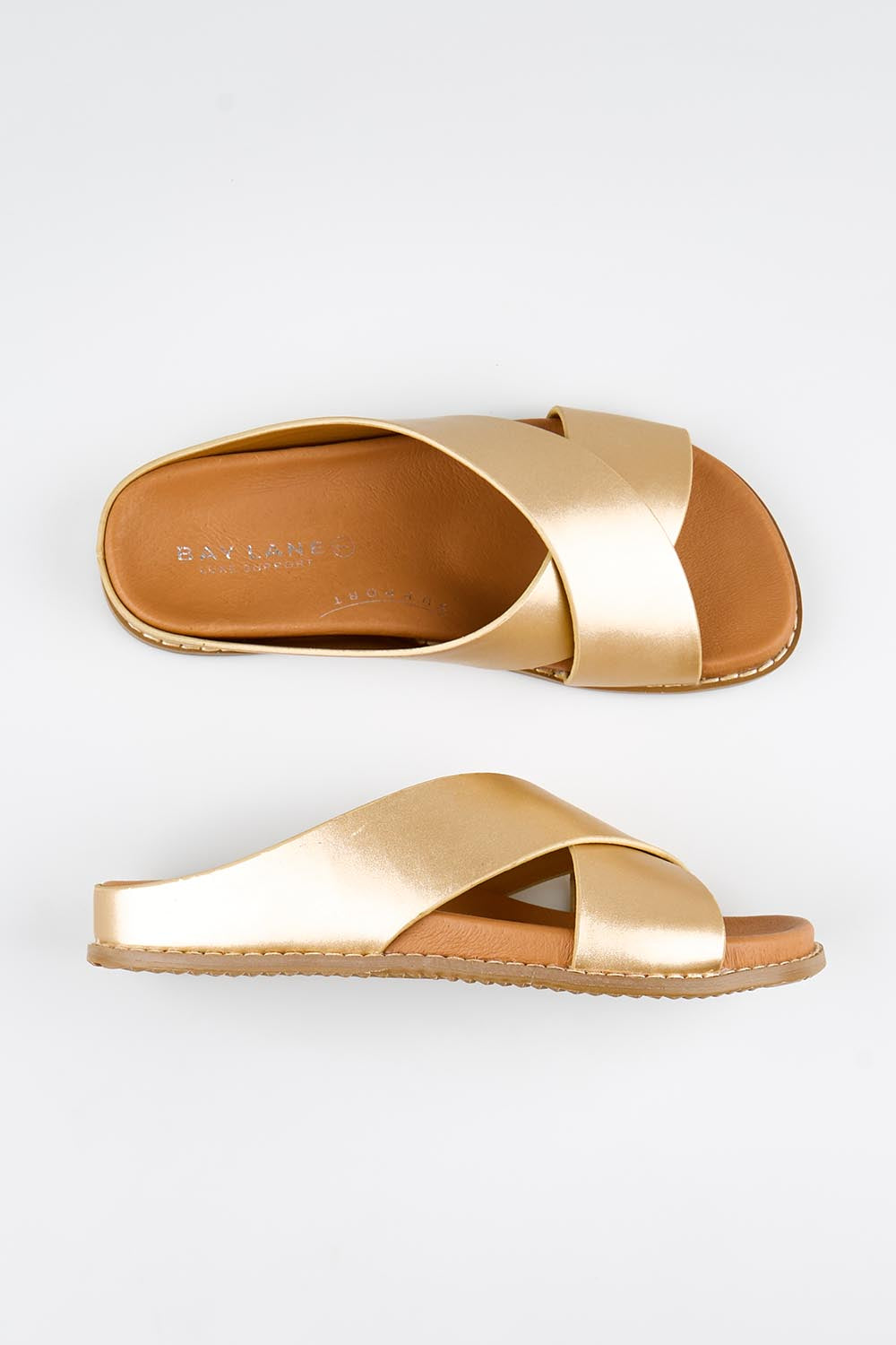 Model Genericm wearing size sample of the Mystic Leather Slide - Champagne in colour Champagne, in a cropped view