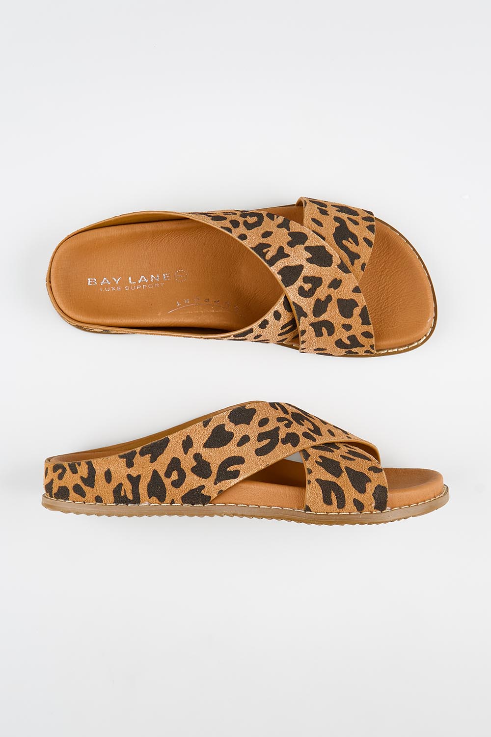 Model Genericm wearing size sample of the Mystic Leather Slide - Leopard in colour Leopard, from an angle