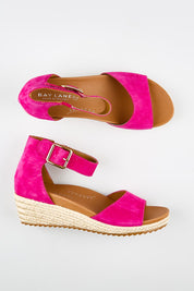 Model Genericm wearing size sample of the Olivia Espadrille Heel - Fushiasuede in colour Fushiasuede, from an angle