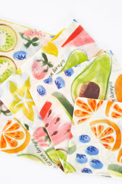 A model wearing size OneSize of the Organic Cotton Four Starter Beeswax Wraps Pack in colour Fruit (White), from the front, showing the whole outfit