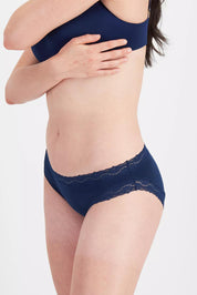 Model Genericm wearing size sample of the Marais Cotton Bikini - Darksapphire in colour Darksapphire, from an angle