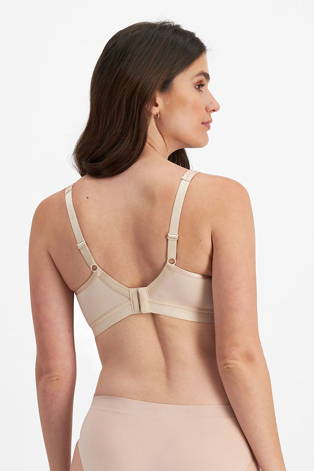 A model wearing the Post Surgery Front Opening Bra in colour Bodytone, from the back