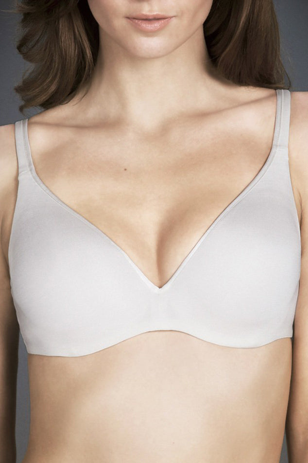 A model wearing the Barely There tin colourshirt  Bra - Ivory (White), from the front, cropped image