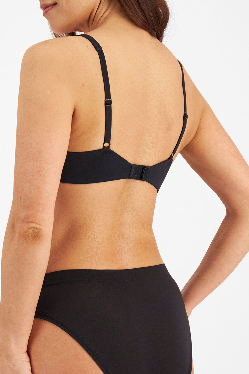 A model wearing the Bbb Contour Comfort Bra in colour Black (Black), from the back