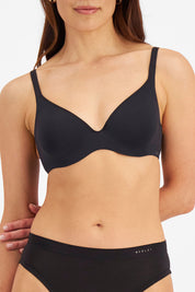 A model wearing the Bbb Contour Comfort Bra in colour Black (Black), from the front, cropped image