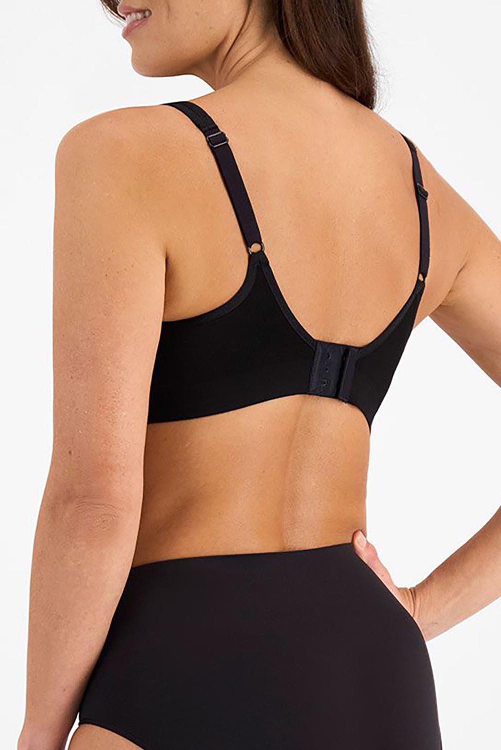 A model wearing the Postin colourSurgery Recovery Bra - Black (Black), from the back