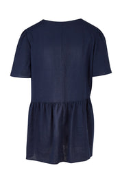 Product shot of the Abigail Blouse in colour Nigshadow (Blue), from the back