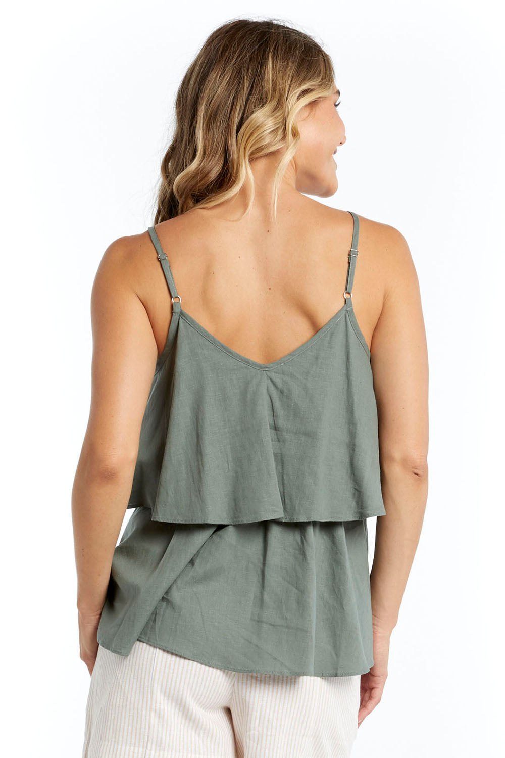 A model wearing the Fifi Cami in colour Deepgrn (Green), from the back