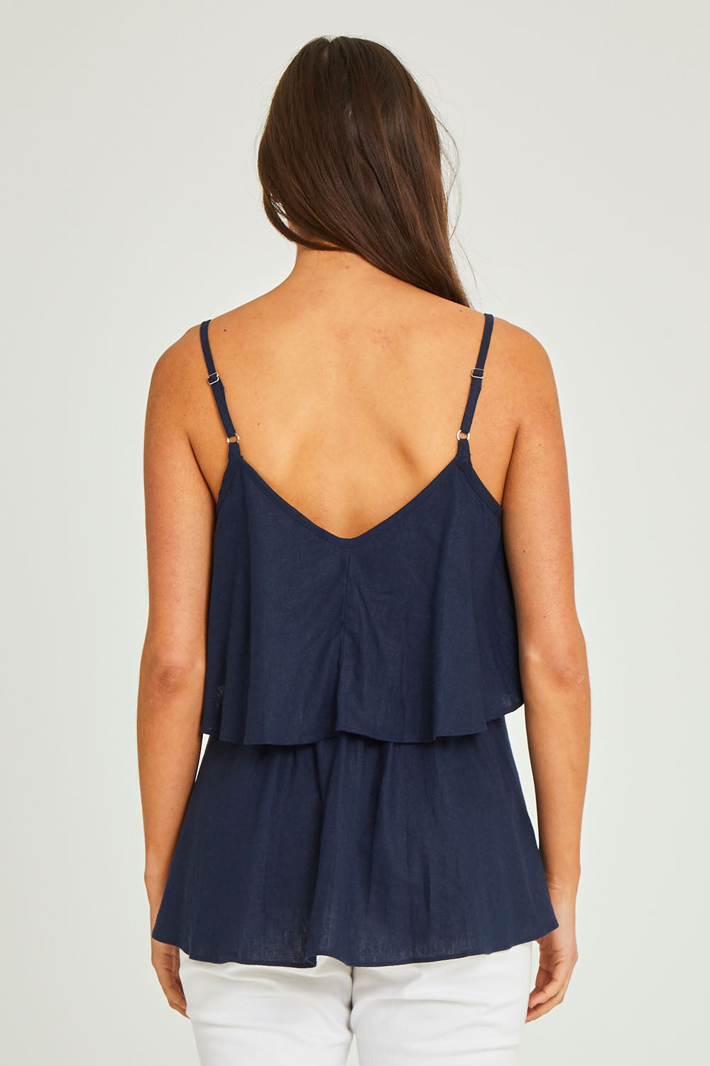 Model Elhana wearing size 10 of the Fifi Cami in colour Nigshadow (Blue), from the back