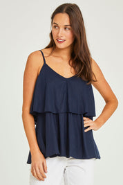 Model Elhana wearing size 10 of the Fifi Cami in colour Nigshadow (Blue), from the front, cropped image