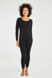 Model Olivia wearing size 10 of the Kelli Long Sleeve Top in colour Black (Black), from the front, showing the whole outfit