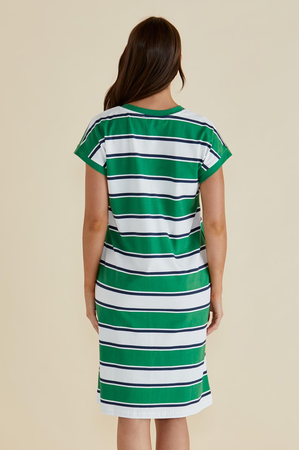 A model wearing the Zena Cotton Tin colourShirt Dress - Green (Green), from the back