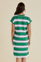 A model wearing the Zena Cotton Tin colourShirt Dress - Green (Green), from the back