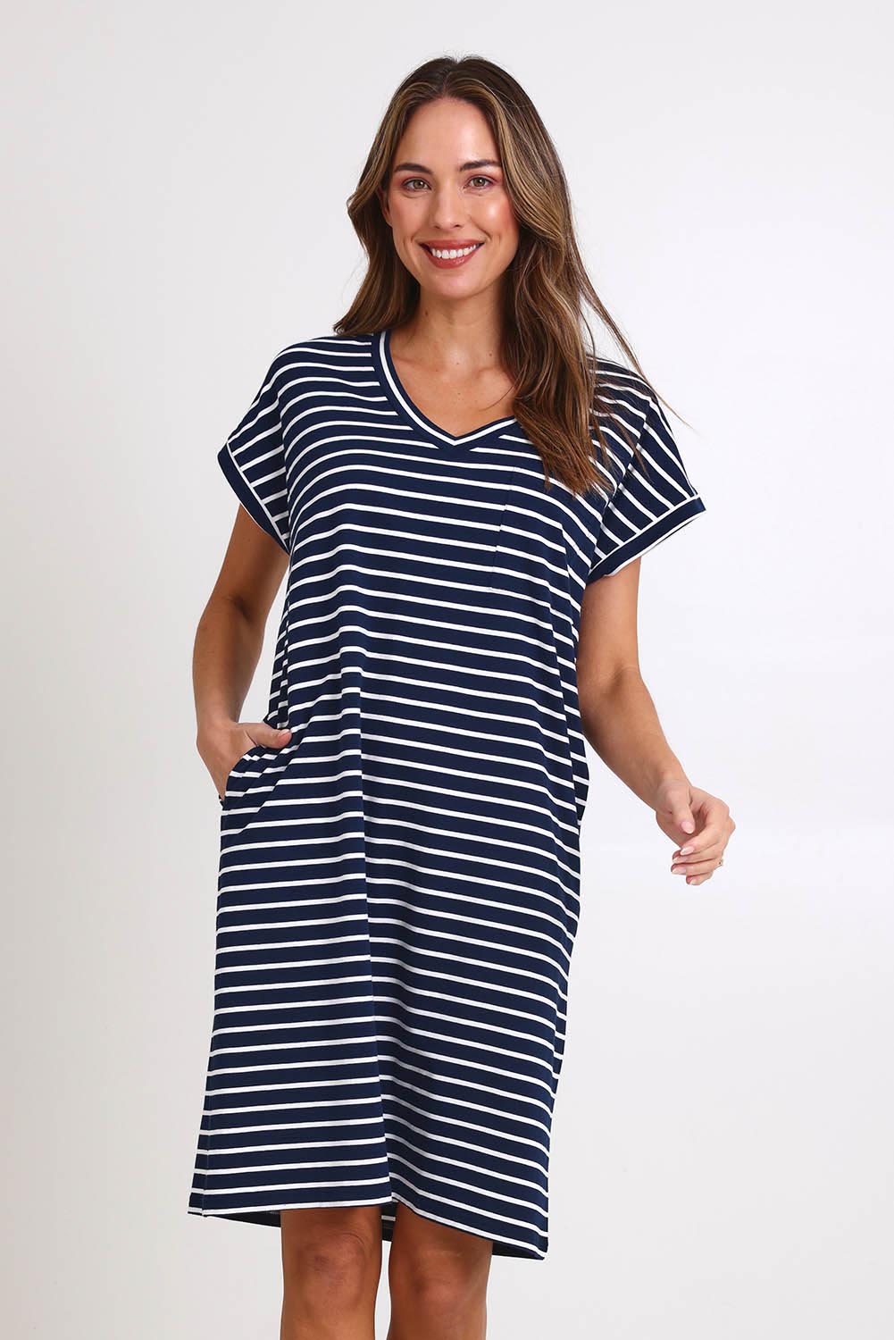 Model Madelinec wearing size 10 of the Zena T-Shirt Dress – Navy in colour Navy, in a cropped view