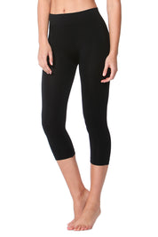 A model wearing the Bridget 3/4 Legging in colour Black (Black), from the front, cropped image
