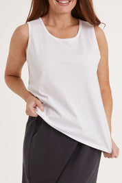 Model Sally wearing size 10 of the Josie Tank in colour White (White), from the front, cropped image