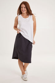 Model Sally wearing size 10 of the Josie Tank in colour White (White), from the front, showing the whole outfit