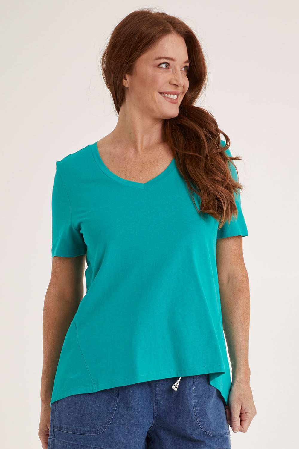 Model Sally wearing size 10 of the Luella Tee in colour Teal (Green), from the front, cropped image
