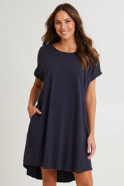 Model Madeline wearing size 10 of the Maxine Australian Cotton Tin colourShirt Dress - Coal (Black), from the front, cropped image