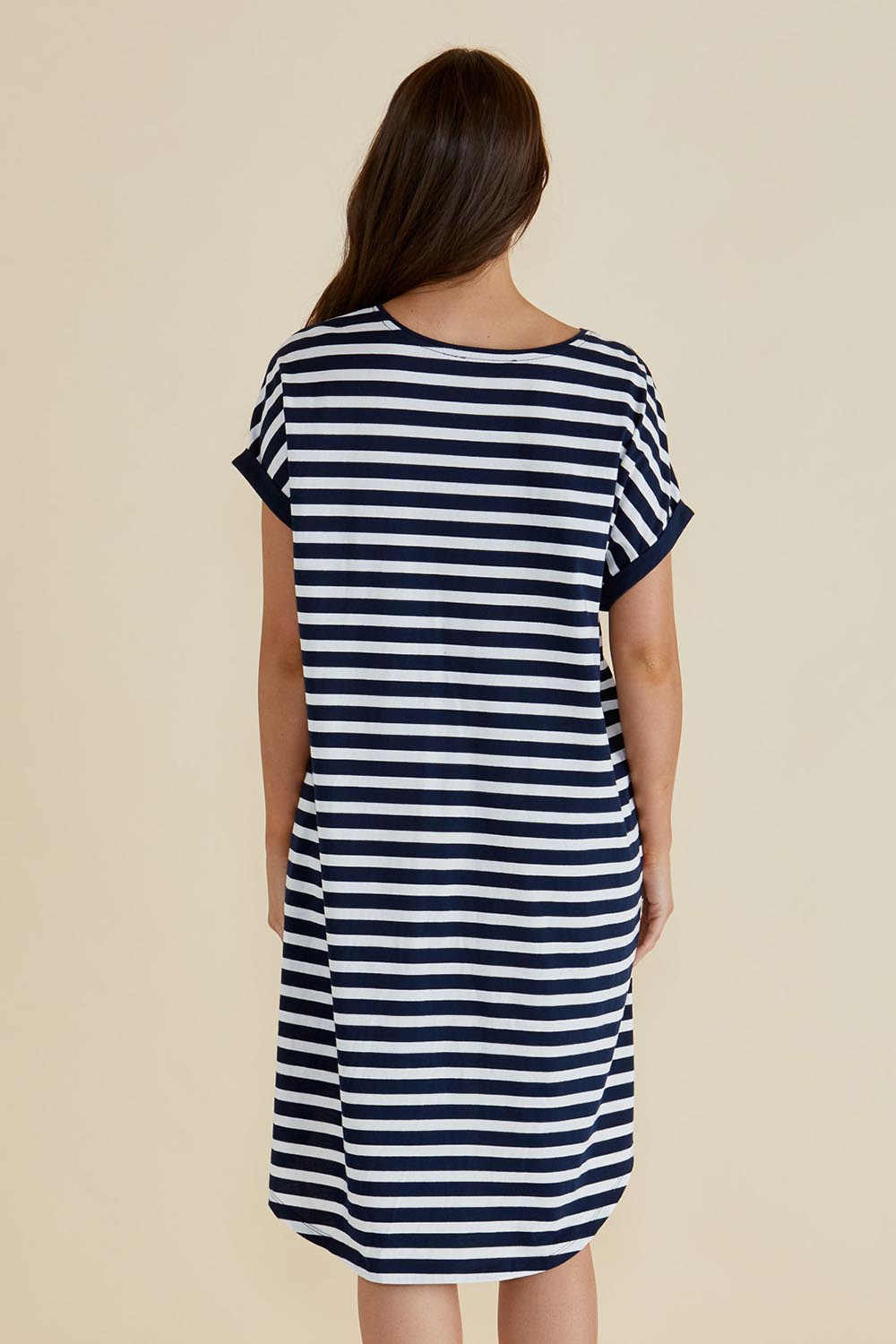 A model wearing the Maxine Australian Cotton Tin colourShirt Dress - Navystripe (Blue), from the back