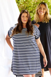 A model wearing the Maxine Australian Cotton Tin colourShirt Dress - Navystripe (Blue), from the front, showing the whole outfit