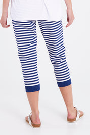 Model Madeline wearing size 10 of the Tasha Crop Jogger in colour Oceanstrip (Blue), from the back