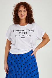 Model Maddy wearing size 16 of the Avril Print Tee in colour White (White), from the front, cropped image