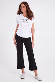 Model Madeline wearing size 10 of the Avril Print Tee in colour White (White), from the front, showing the whole outfit