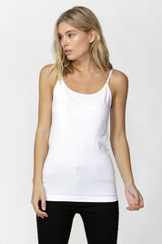 A model wearing the Vivienne Singlet in colour White (White), from the front, cropped image