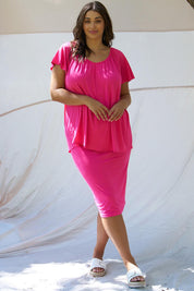 A model wearing the Coral Bamboo Shirred Tee in colour Pink (Pink), from the front, showing the whole outfit