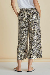 A model wearing the Crystal Bamboo Crop Jogger in colour Cheetah, from the back