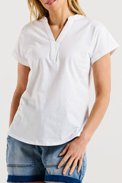 A model wearing the Bridie Cotton Tee in colour White (White), from the front, cropped image