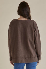 A model wearing the Roxette Cotton Tee in colour Chocolate, from the back